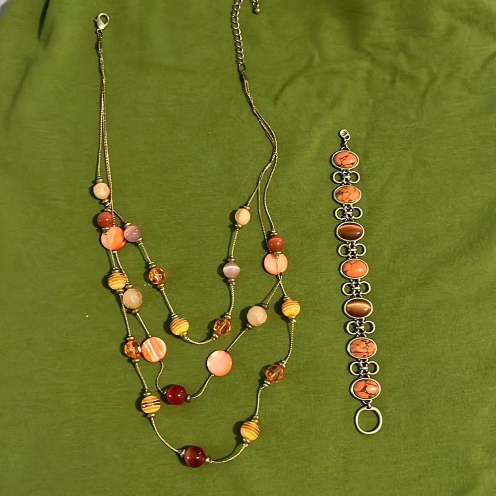 Multi stranded coral colored necklace with matching bracelet set